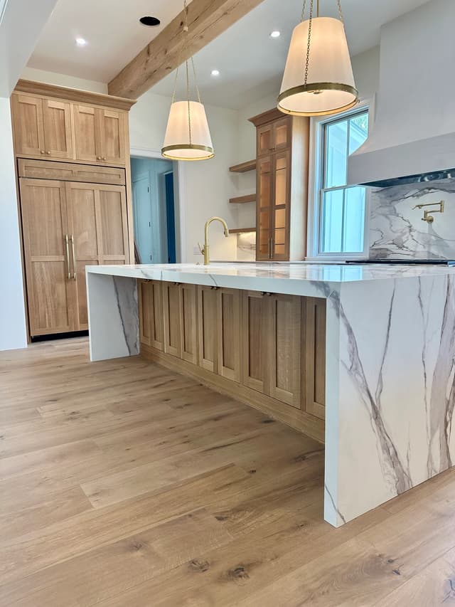 Warm oak Magnolia kitchen with Italian marble and waterfall island